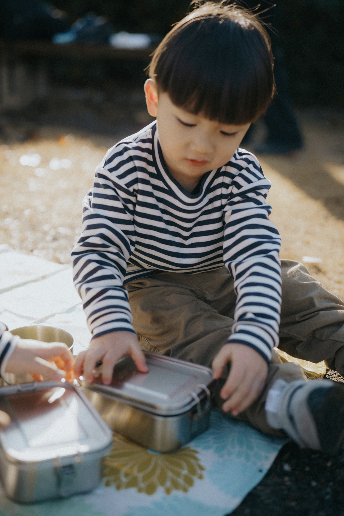 A Kinder Nest 304 stainless steel lunch box / container - available in three sizes with adjustable dividers for plastic-free meals.
