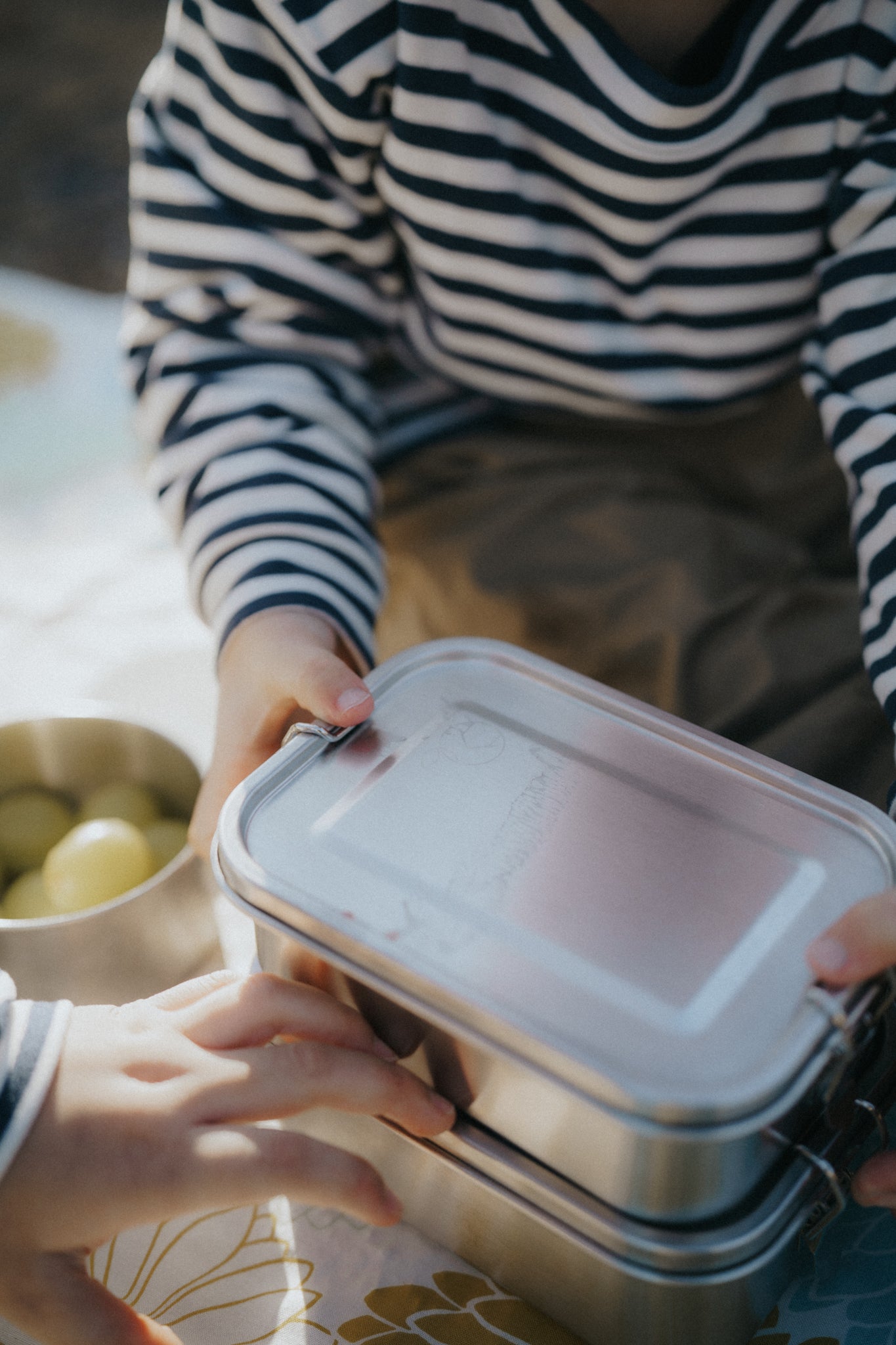 A Kinder Nest 304 stainless steel lunch box / container - available in three sizes with adjustable dividers for plastic-free meals.
