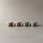 A Kinder Nest set of 2 stainless steel mini sauce containers with leakproof silicone lids, 60ml capacity