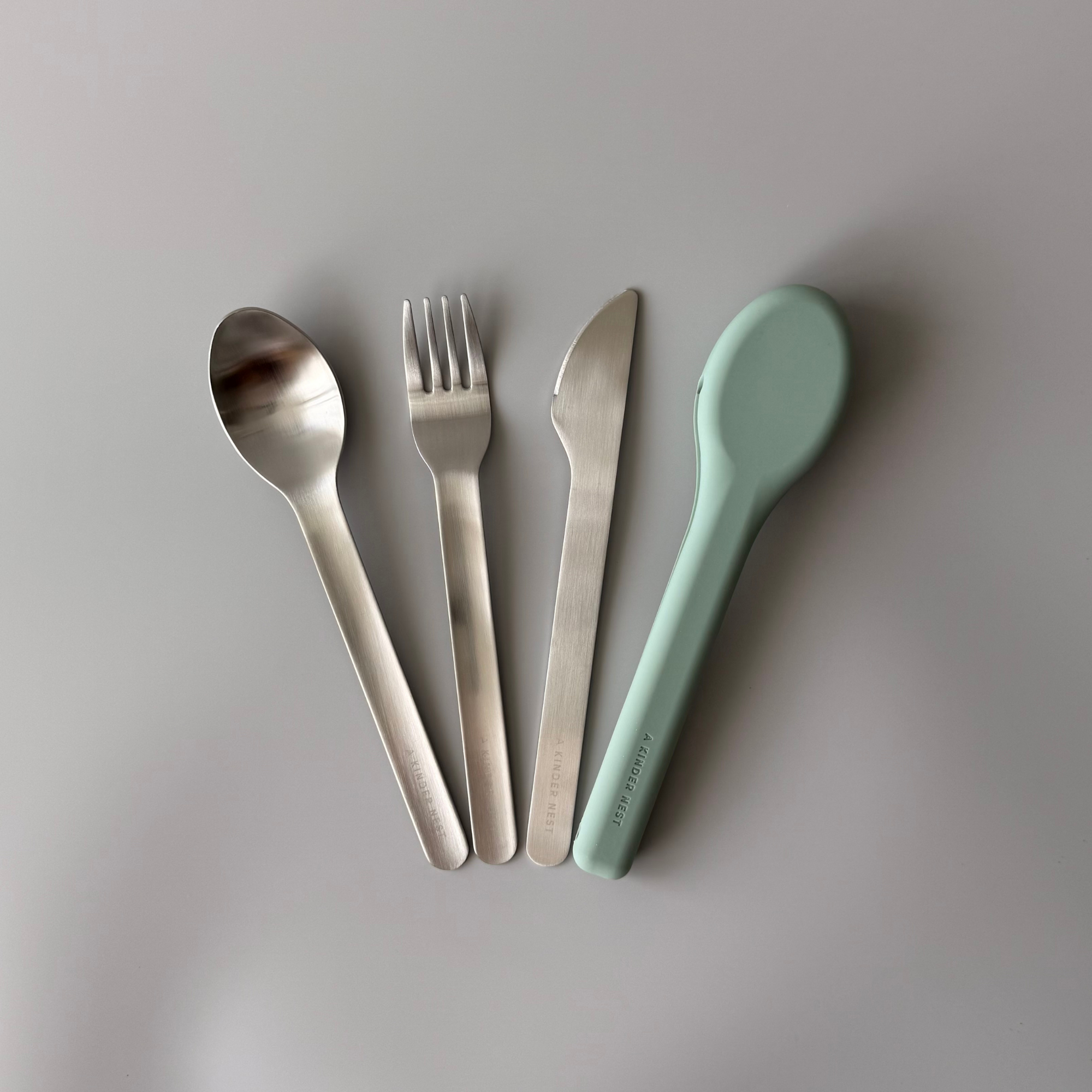 Stainless steel cutlery sets showing different color options for the washable silicone travel pouches.