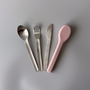 A Kinder Nest 3-piece reusable stainless steel cutlery set with a washable silicone travel pouch.